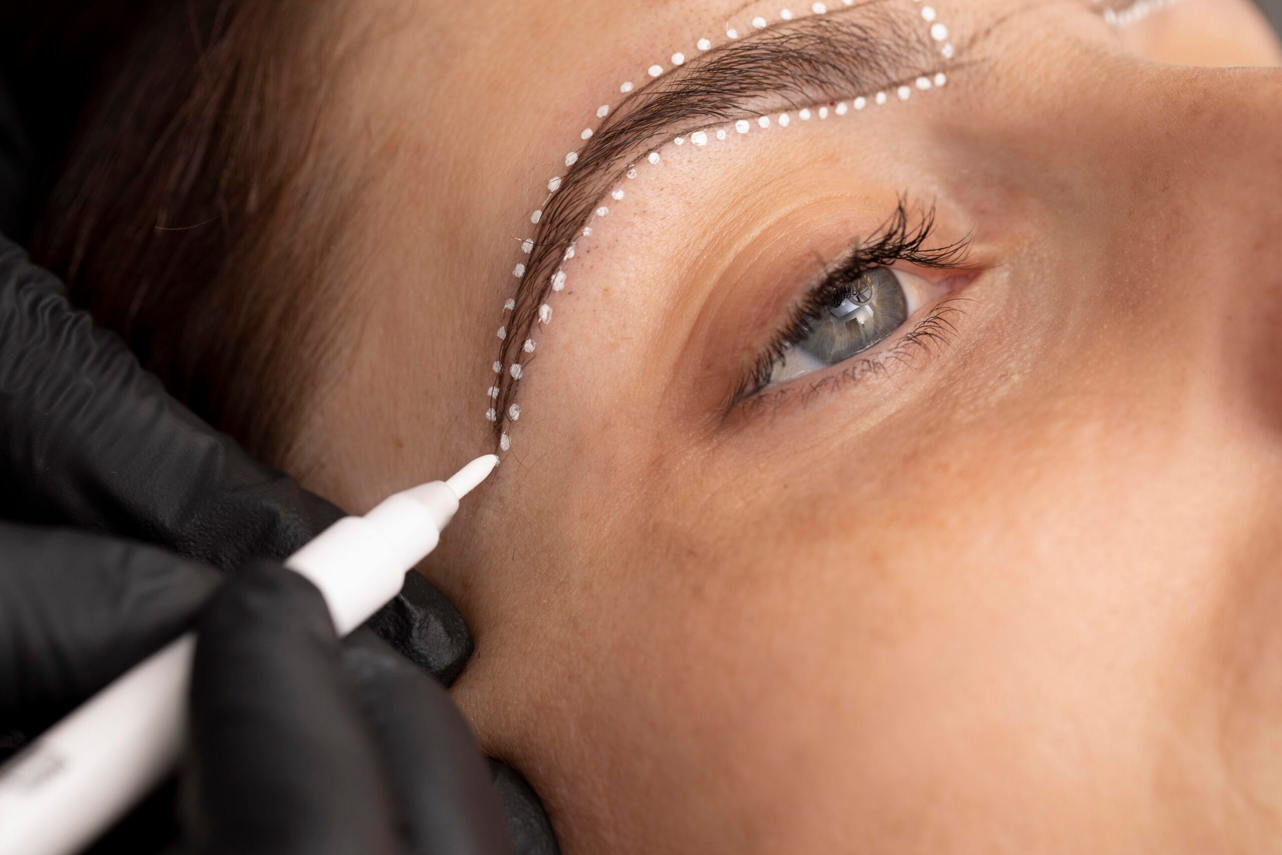 woman going through microblading treatment scaled